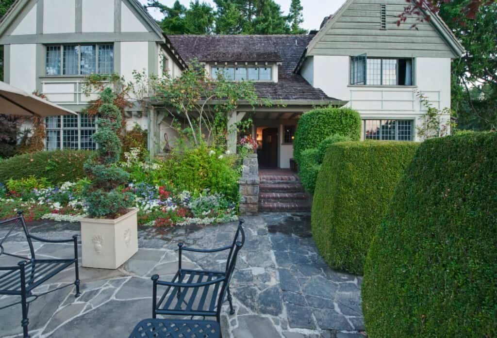 Beautiful landscaped garden with stone pathway and lush greenery.